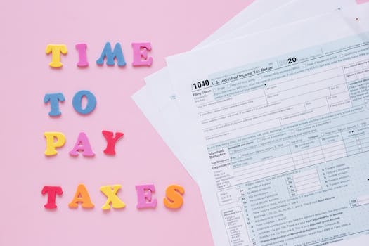 1040 tax forms with colorful 'Time to Pay Taxes' letters.